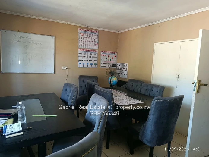 Prime Masvingo CBD Office/flat currently being used as a Driving school, Car wash and restaurant.
